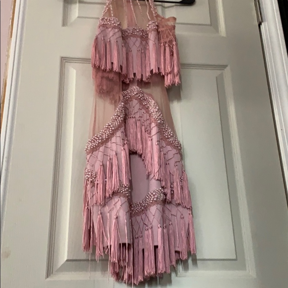 Beautiful pink dress with cut outs and tassels!